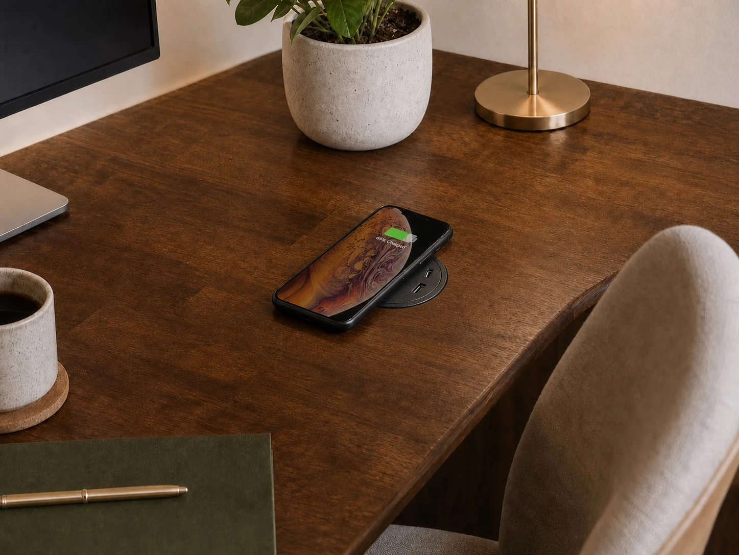 Wireless charging pad and USB socket integrated into a desk