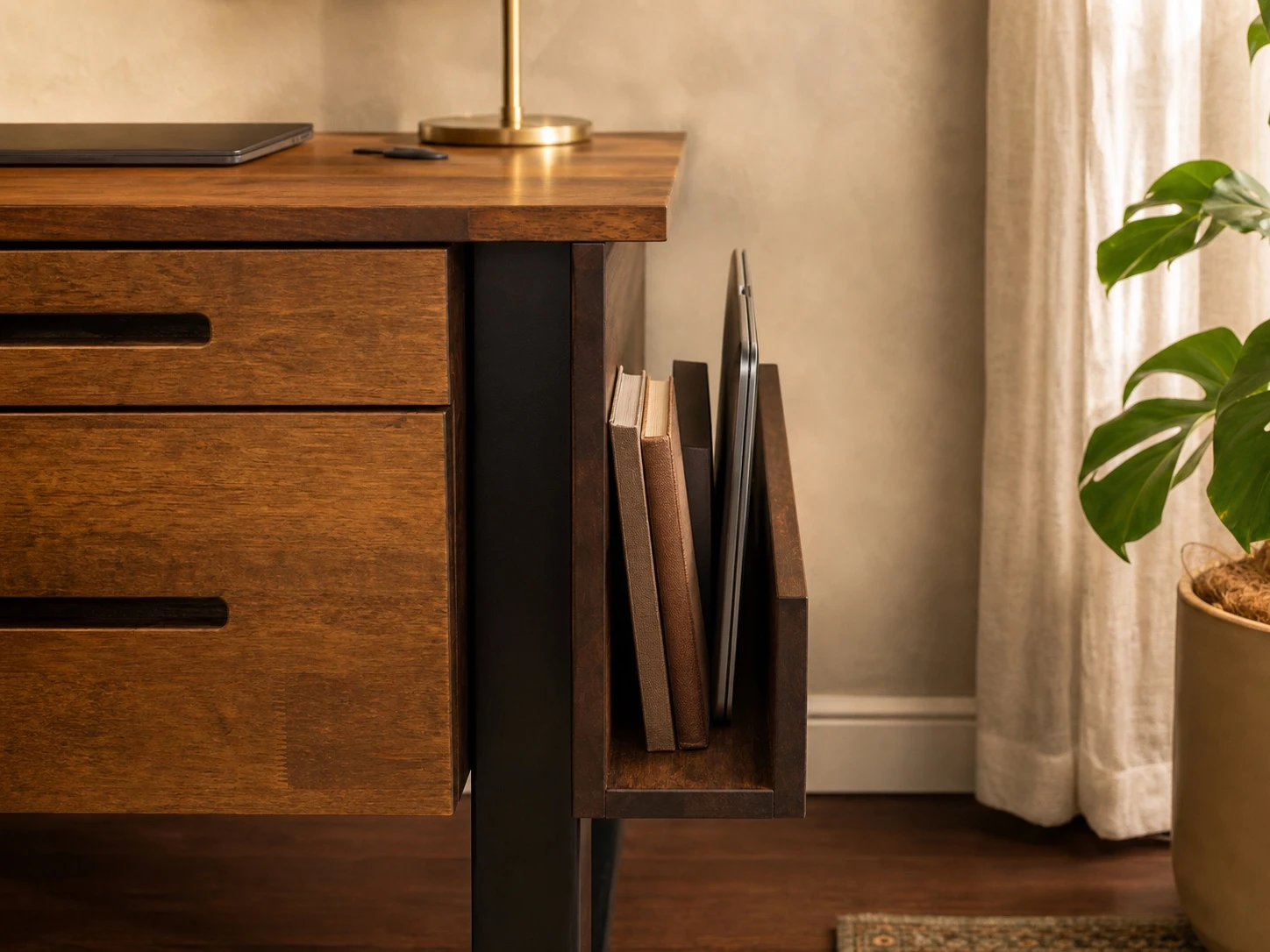 Custom solid-wood side extension holding books and a laptop beside a desk