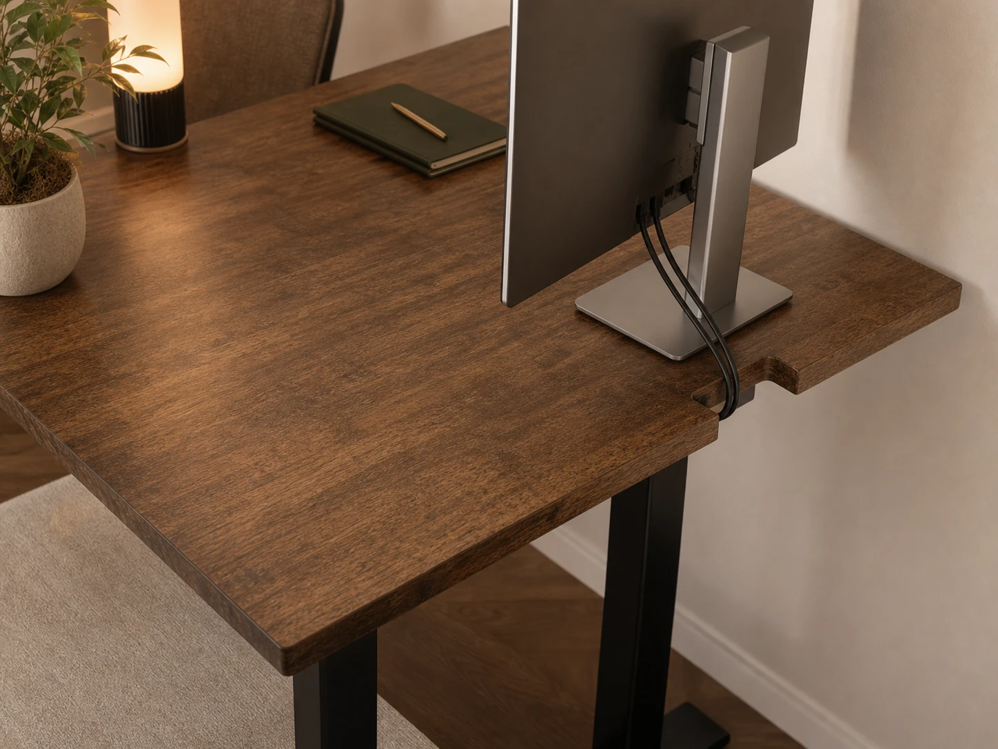 Rectangular cable cut-out at the rear edge of a solid-wood desk
