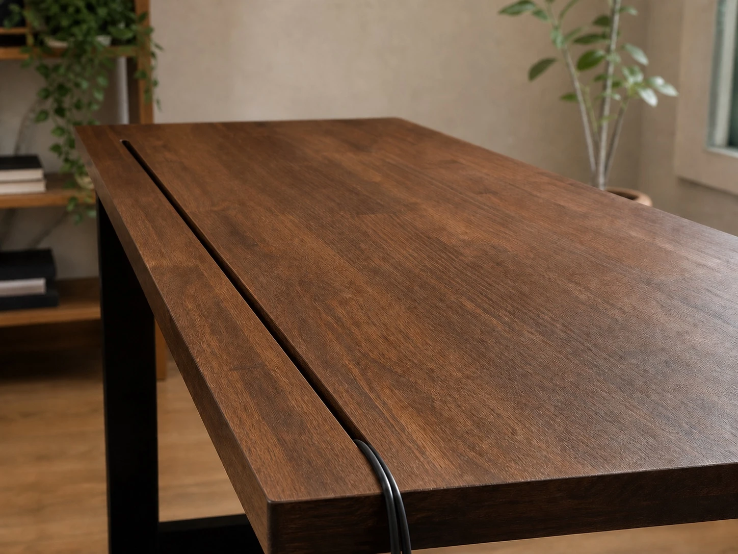 Long narrow rear slit cable cut-out with a rounded cable exit in a solid-wood tabletop