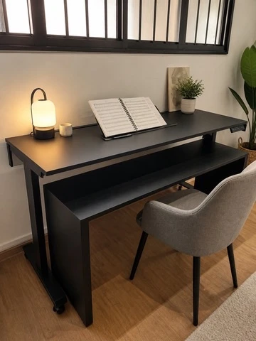 Black custom piano desk prepared for music practice