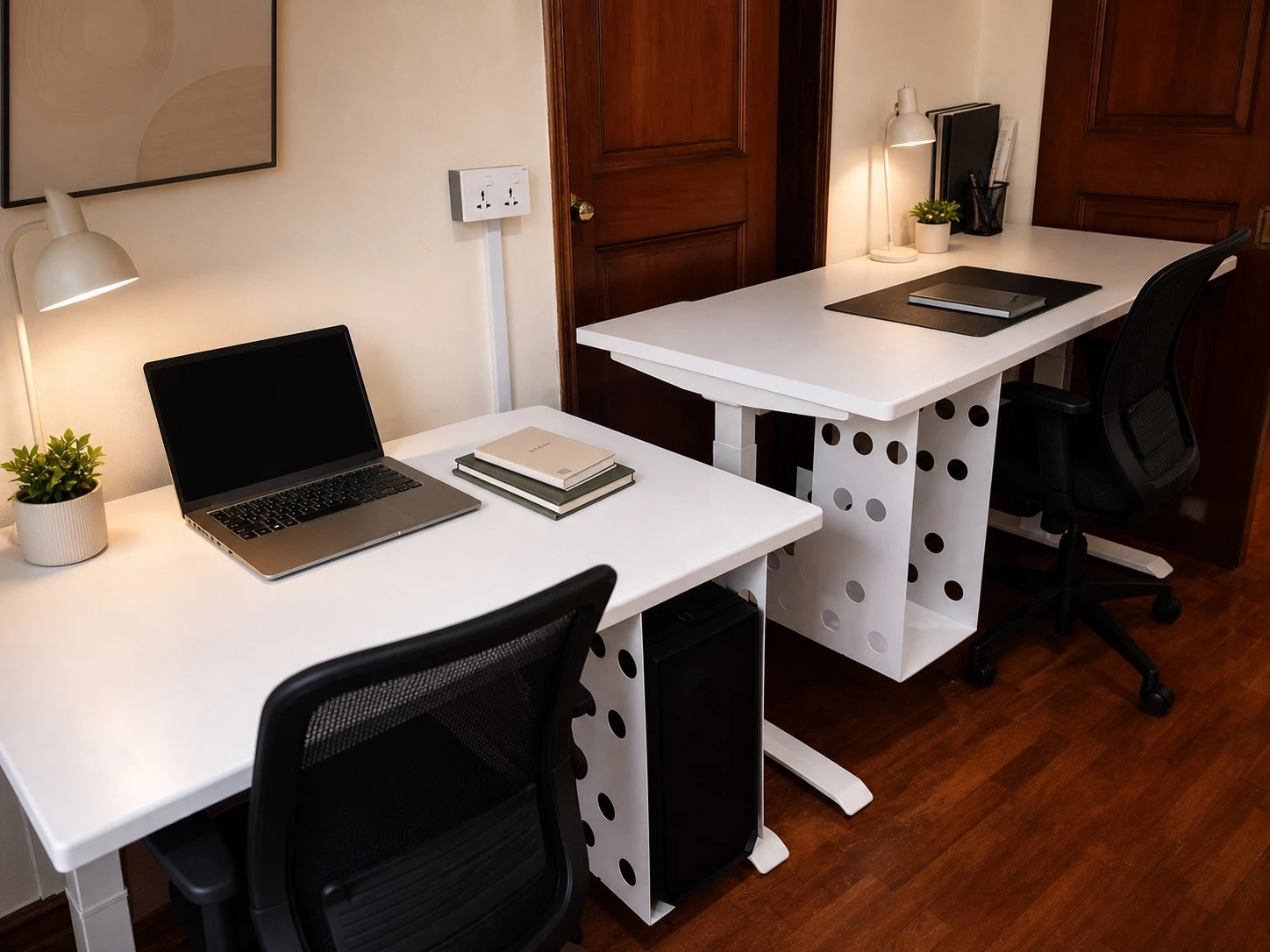Two coordinated white L-shaped workstations with ventilated computer storage