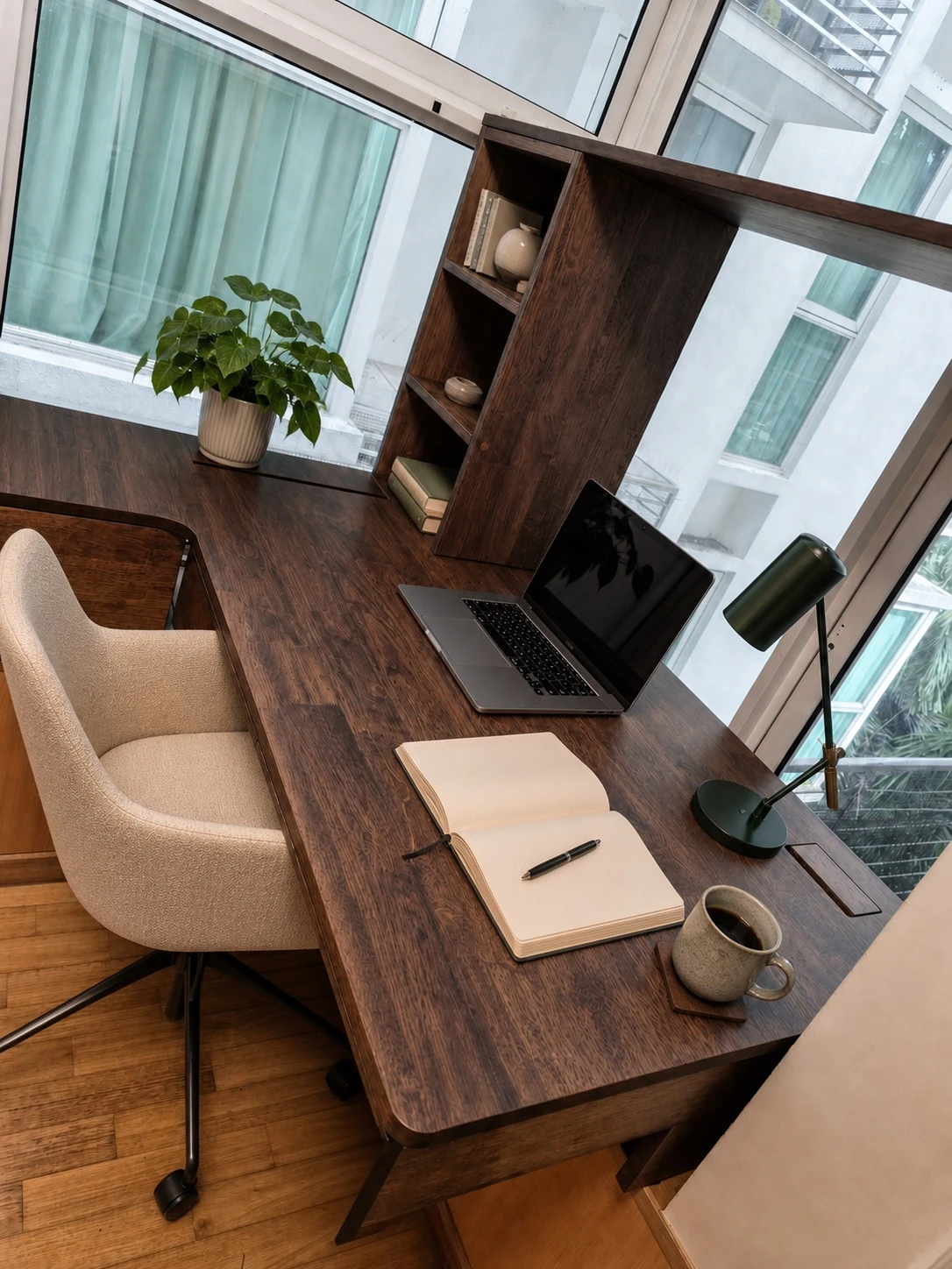 L-shaped solid-wood desk supported on a window ledge with integrated drawers